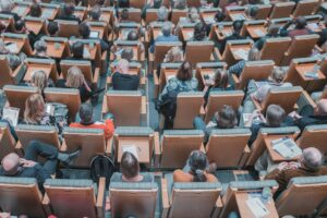 Students in lecture hall, pic by Mikael Kristenson on Unsplash